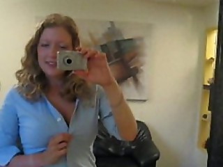 Busty girl next door Andy Lynn takes picture of herself in the mirror